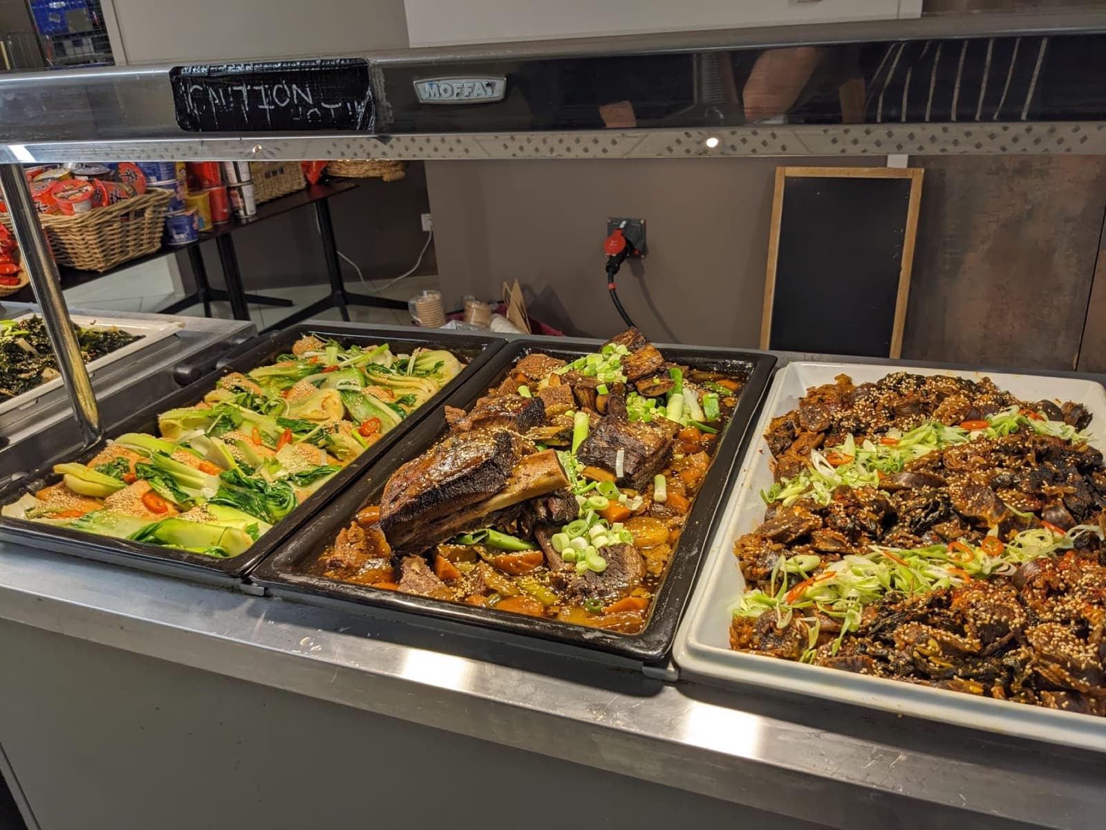 Korean buffet dishes prepared for European touring catering